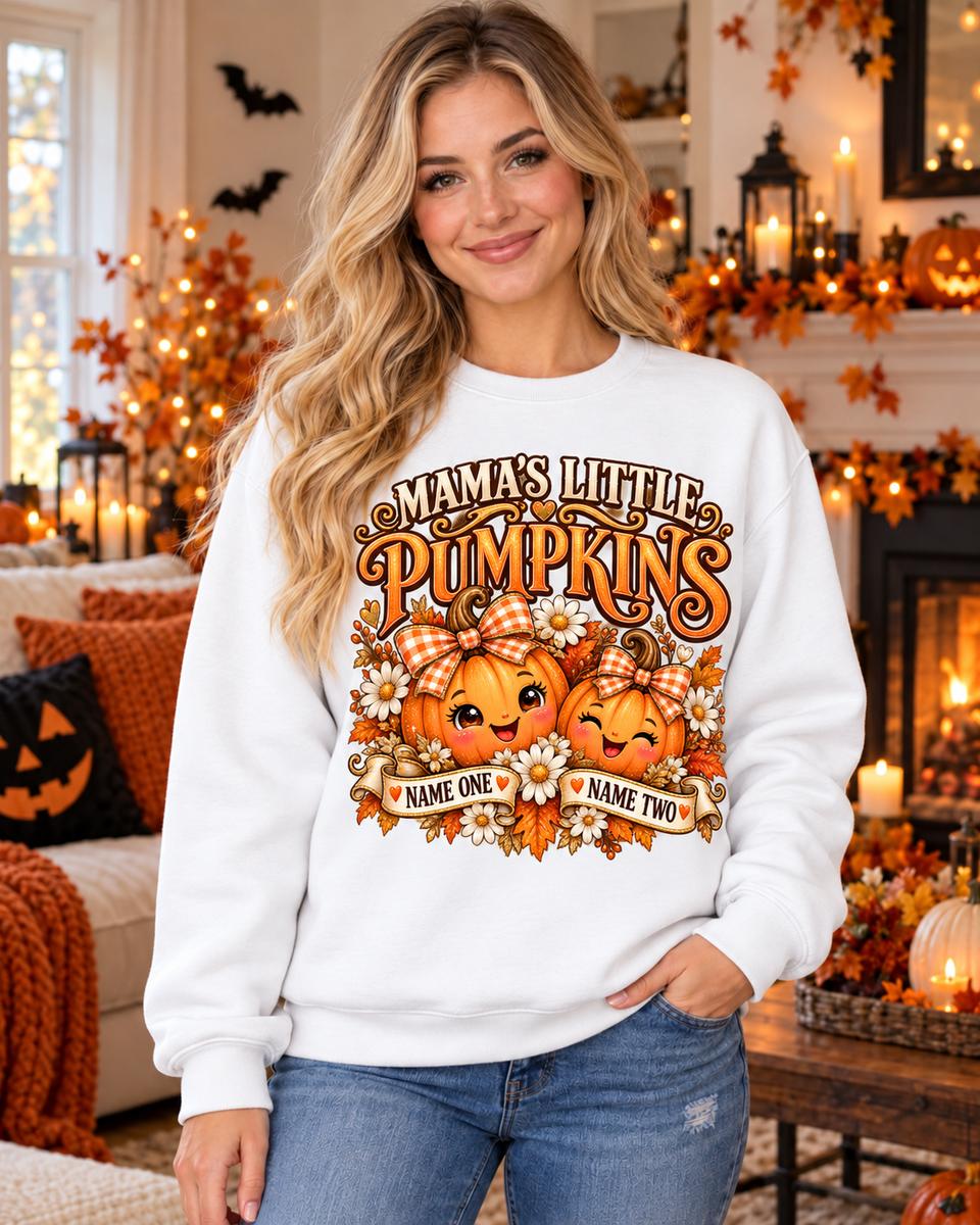 Smiling blonde woman wearing Mama’s Little Pumpkins Personalized Halloween Sweatshirt – Custom Two Names in a Halloween decorated living room